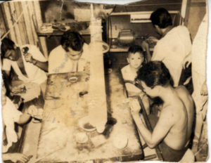 A very young Norris playing in the “plateria,” or area where jewelry is crafted, at the back of the store